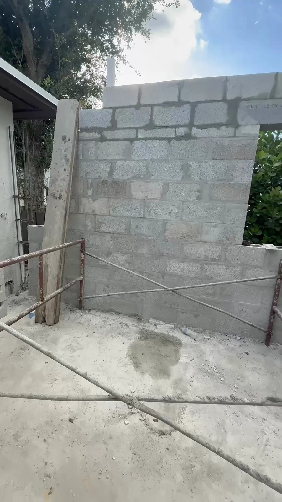 CMU wall under construction with reinforced concrete columns